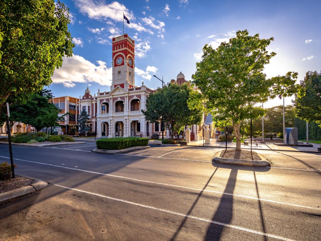 City Hall building in Toowoomba, Australia, with flag flying against the blue sky above