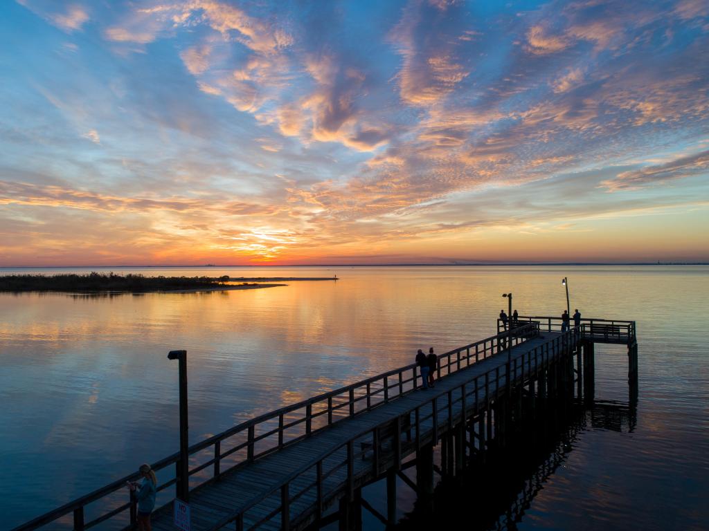 Mobile Bay, Mobile, Alabama, USA taken at a pier at Alabama Bayfront Park during sunset.