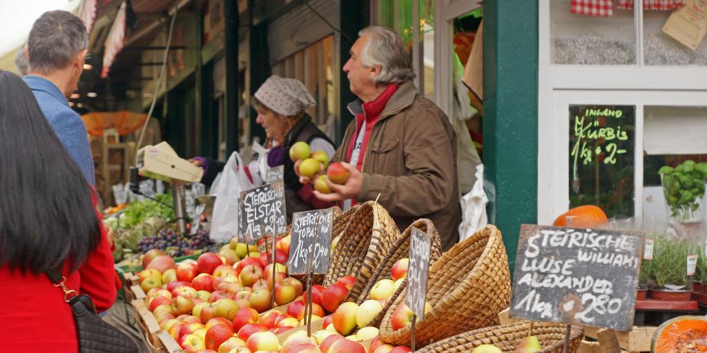 People buying produce at Naschmarkt in Vienna