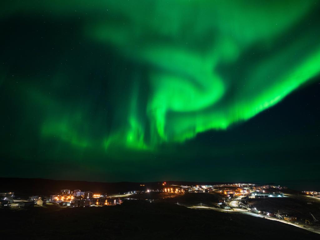 Northern Lights over the town of Iqaluit, Nunavut