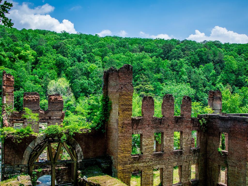 Sweetwater Creek State Park, Atlanta, USA with a view of the Sweetwater Creek State Park and the mill ruins in the foreground on a sunny day.