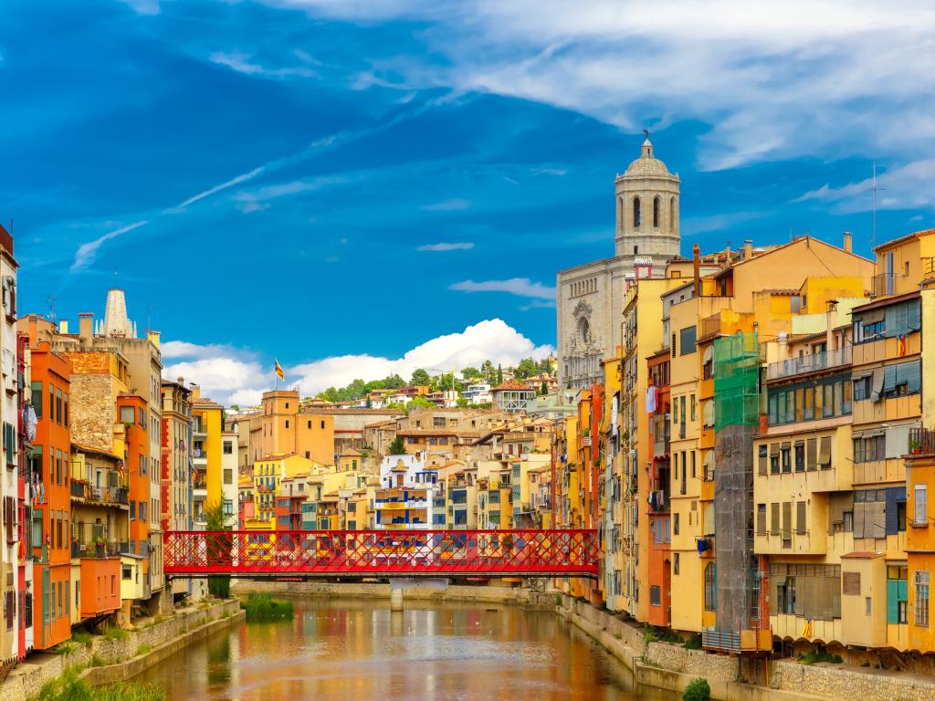 Colorful houses and Eiffel Bridge, old fish stalls in Girona