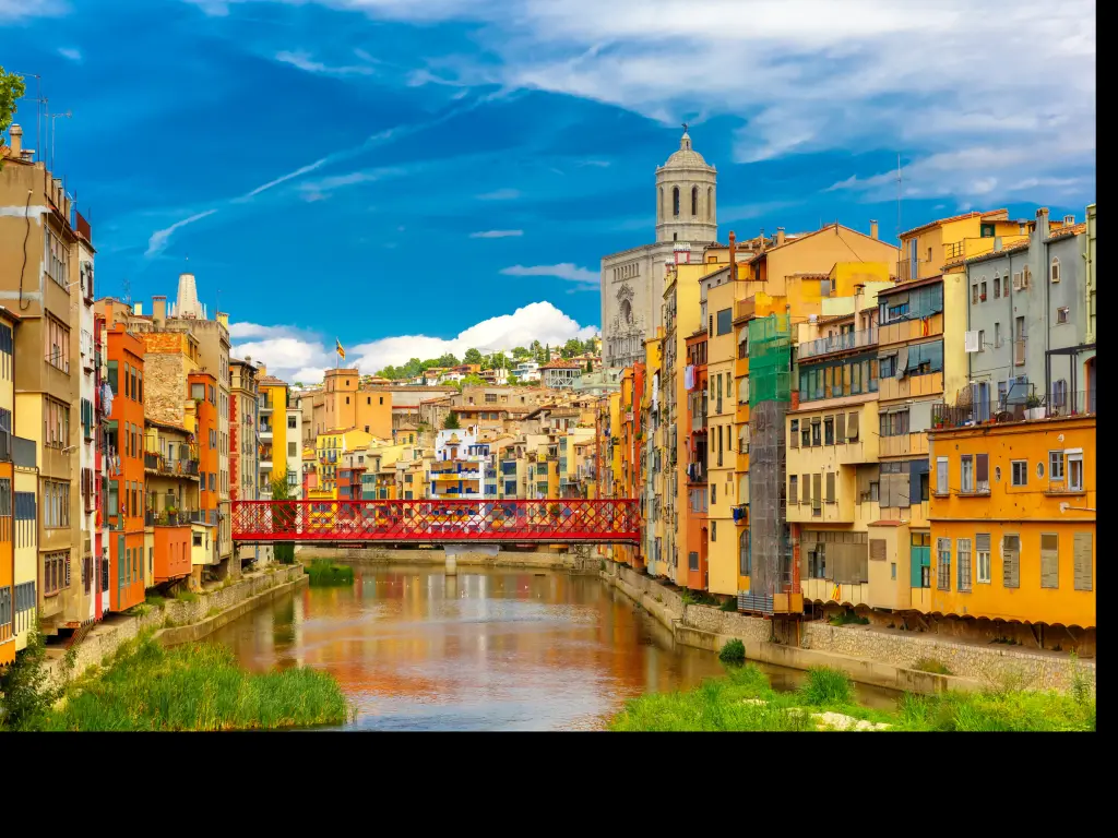 Colorful houses and Eiffel Bridge, old fish stalls in Girona