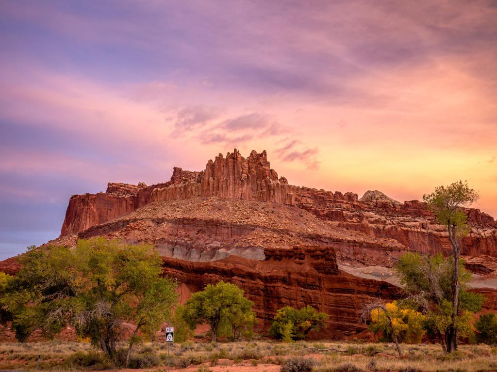 Capitol Reef National Park, Utah, USA taken at sunset with red cliffs in the distance.