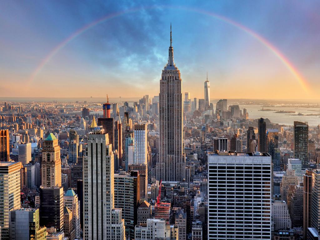 New York City skyline with urban skyscrapers and rainbow.