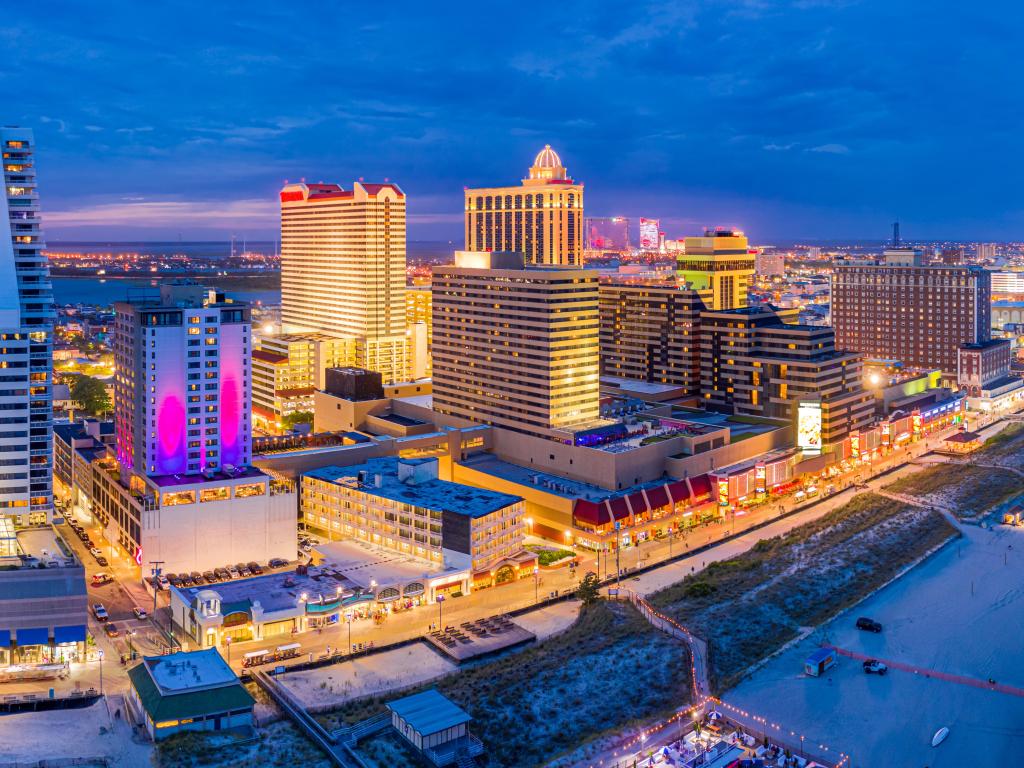 Aerial panorama of Atlantic city along the boardwalk at dusk.