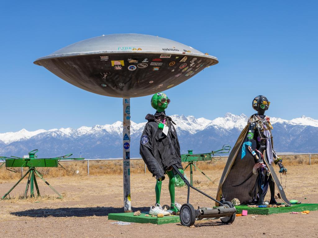 Alien Sculptures stand outside the UFO Watchtower and Information Center, a curious attraction located near Alamosa, Colorado
