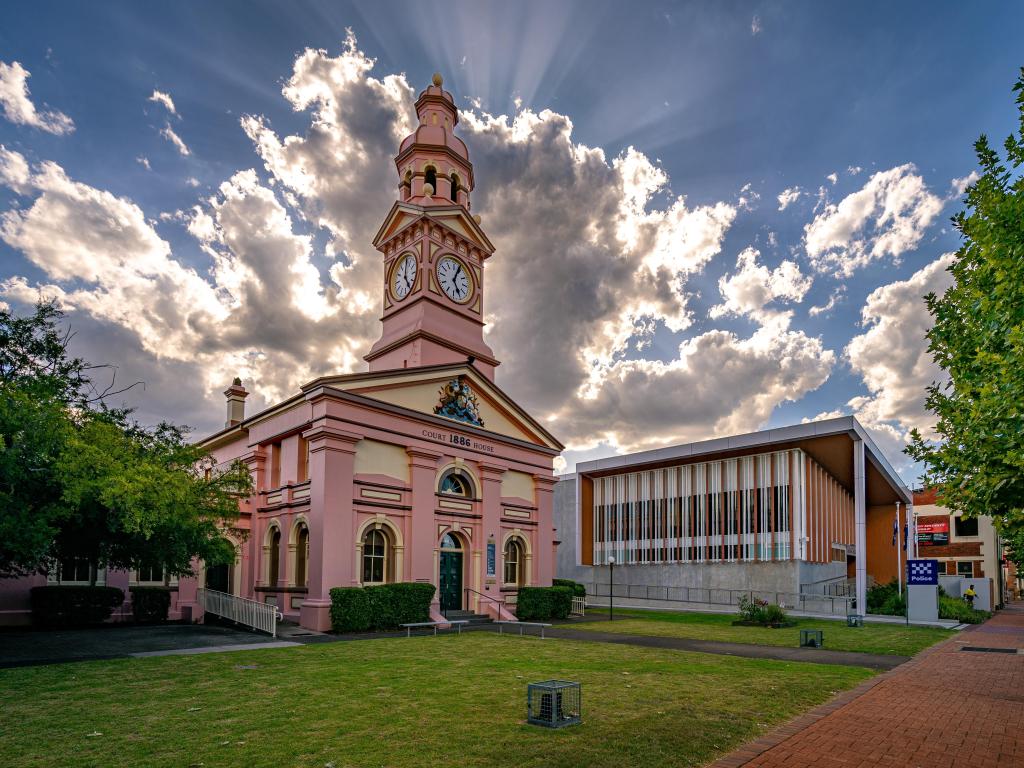 Historical Local Courthouse building with dramatic clouds in the sky behind the building