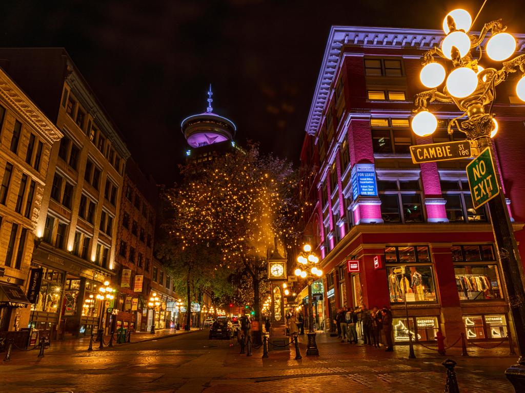 Vancouver,BC/Canada taken at night at the scene of Gastown in Vancouver with the Iconic old steam clock and rows of buildings lit by street lamps. 