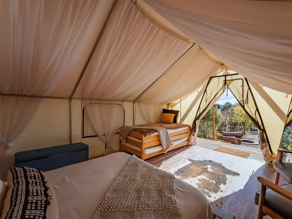 Inside luxury glamping tent at Zion Ponderosa, with luxury fixtures and fittings, and outdoor terrace