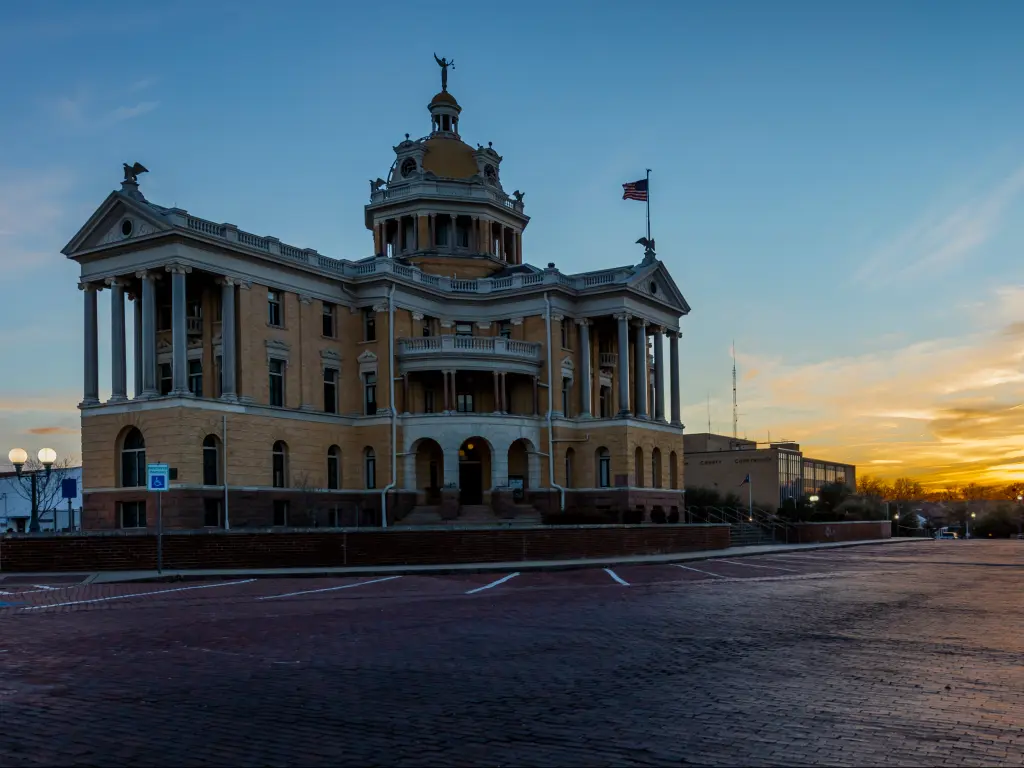 Harrison County Courthouse building at dusk in Marshall, Texas