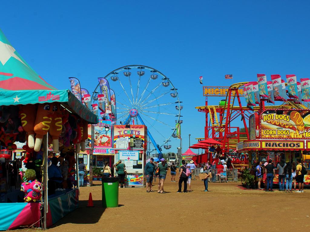 Poteet Strawberry Festival, carnival rides and stalls during a sunny day