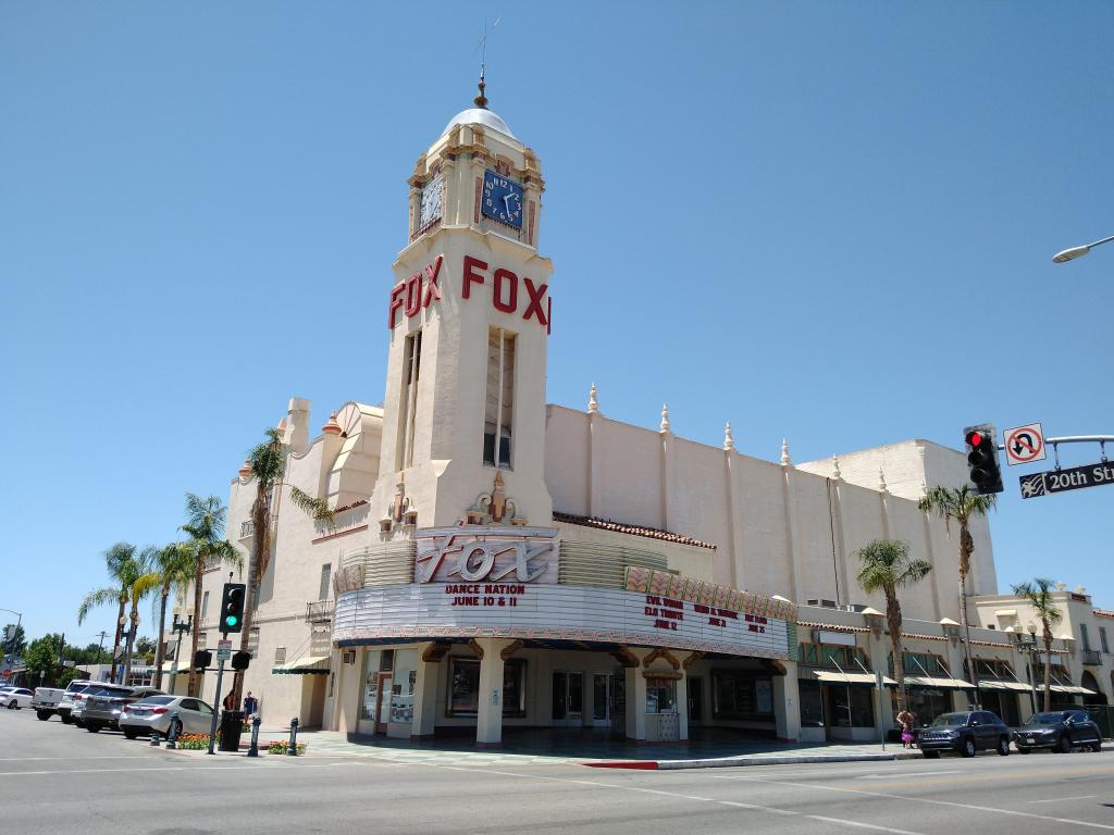 White exterior of the historic theater venue on a sunny day