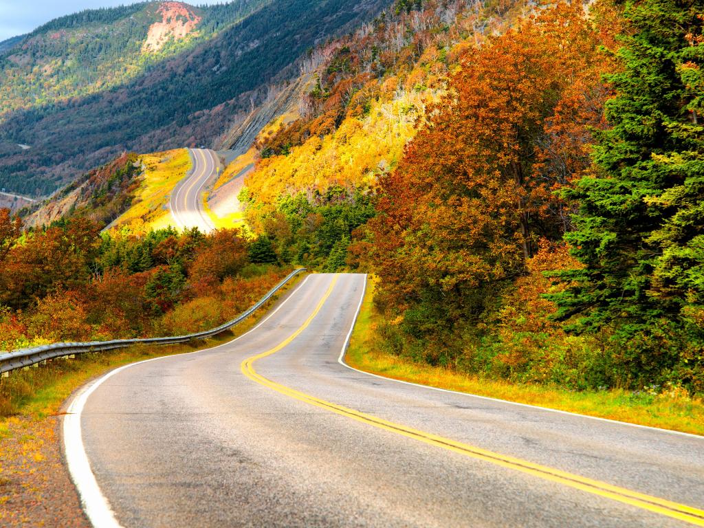 Cabot Trail in Cape Breton Island, the road running through autumnal colors and folgiage