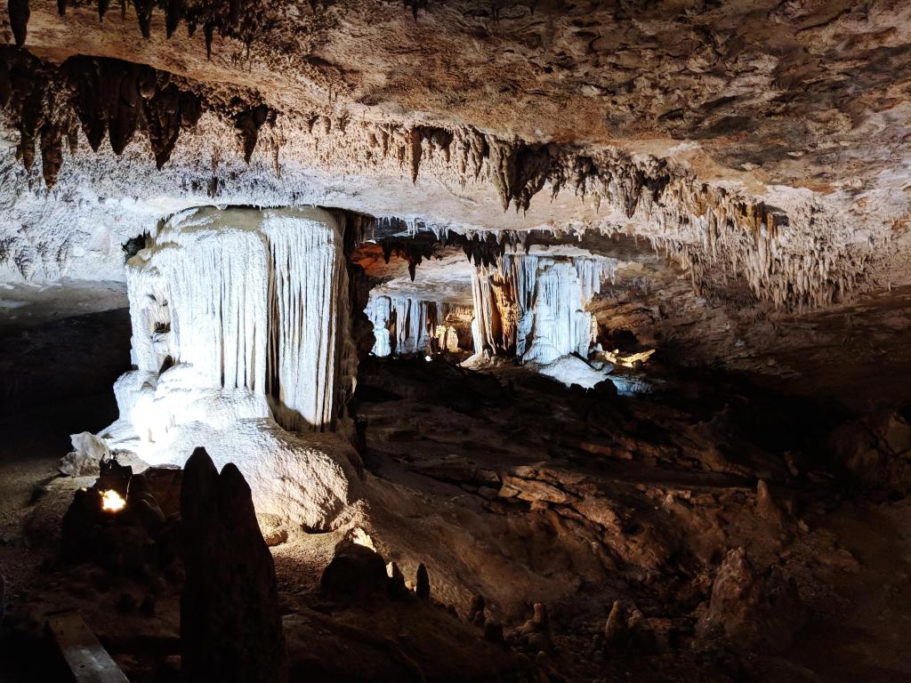 Lit up caverns with impressive stalactites and stalagmites