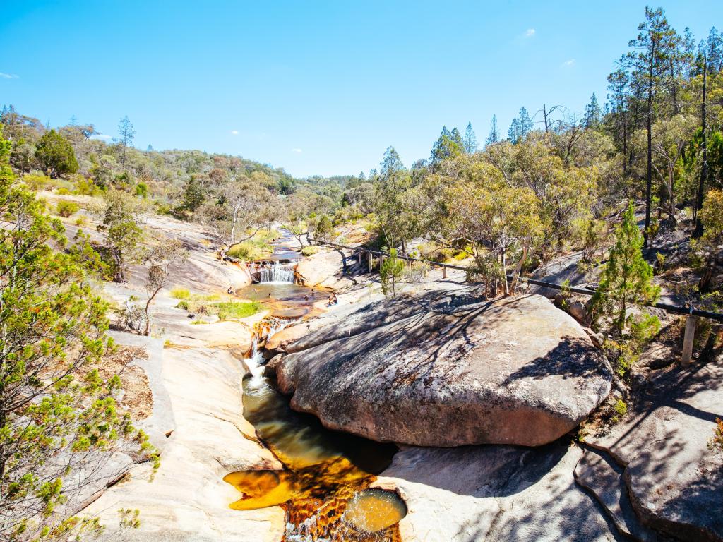 Small waterfall makes its way through rocky river bed