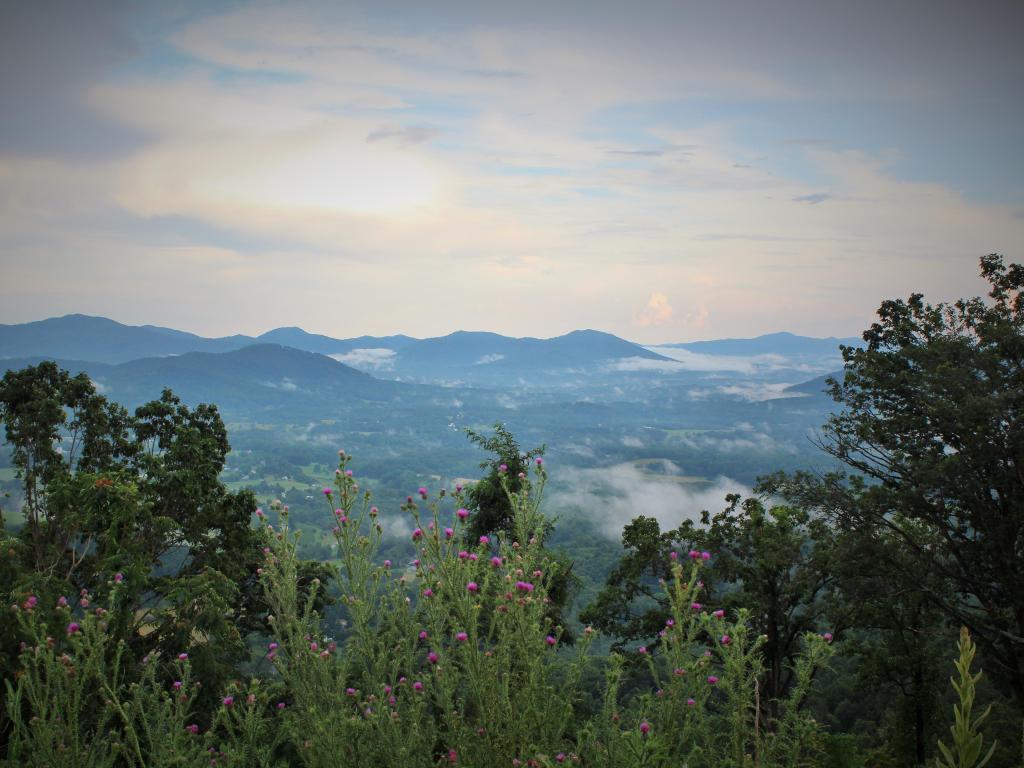 View overlooking the Shenandoah Valley from Rockfish Gap in Charlottesville, with sunset seen through the mist