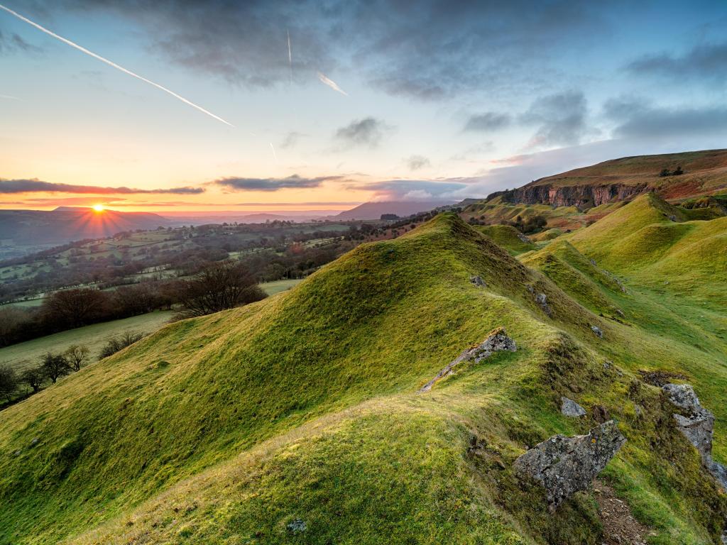 Brecon Beacons National Park, Wales with a beautiful sunrise over the Llangattock Escarpment overlooking beautiful hills and valleys.