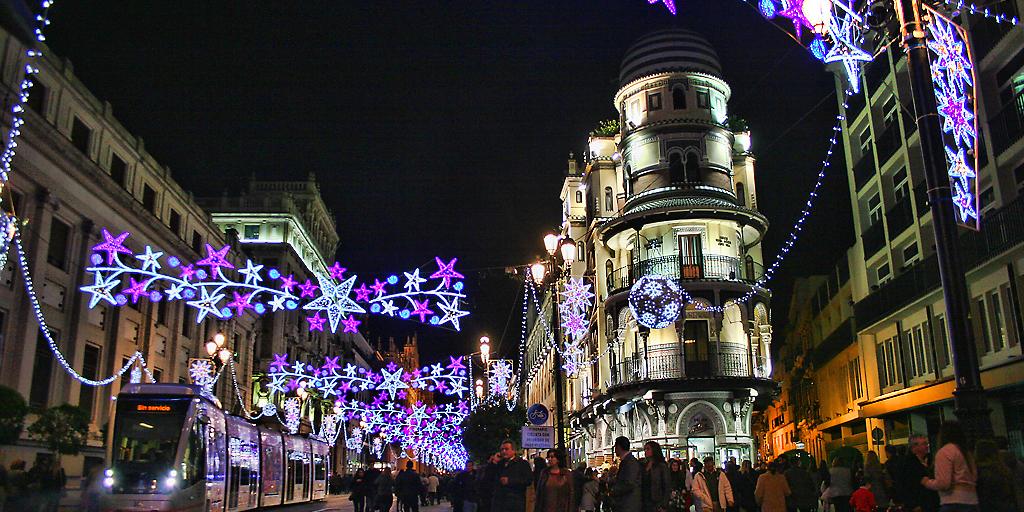 Purple fair lights hang over the streets of Seville at Christmas time