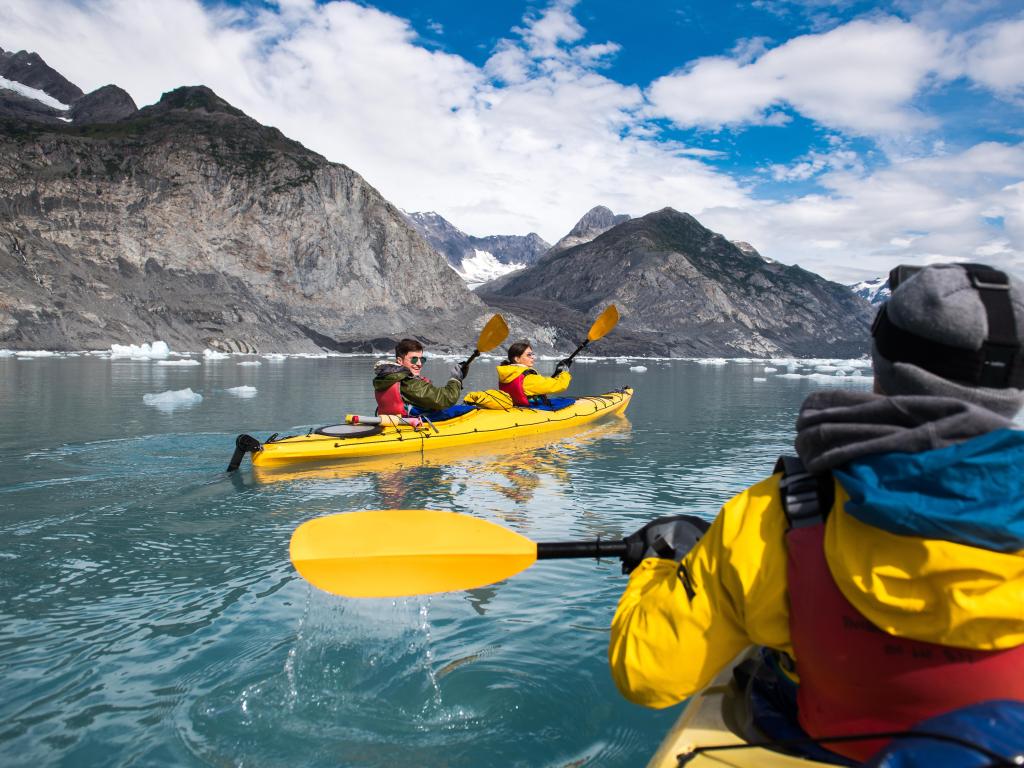 Ocean kayaking bear glacier during their vacation trip to in Alaska, USA