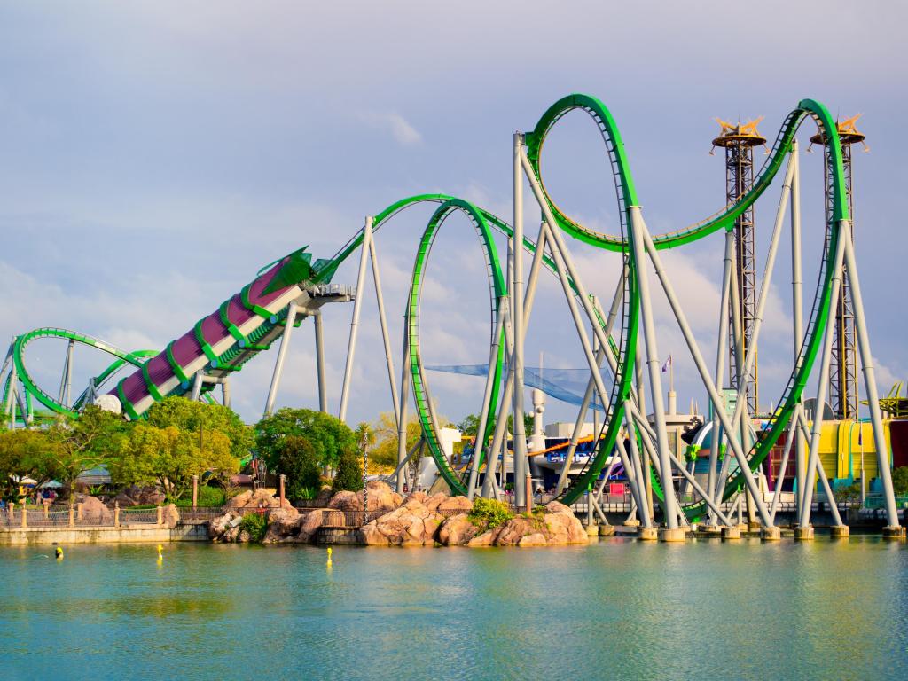 Orlando, Florida, USA with a roller coaster in the park. Universal Studios is one of Orlando famous theme parks. Universal in Orlando, Florida on April 3, 2014