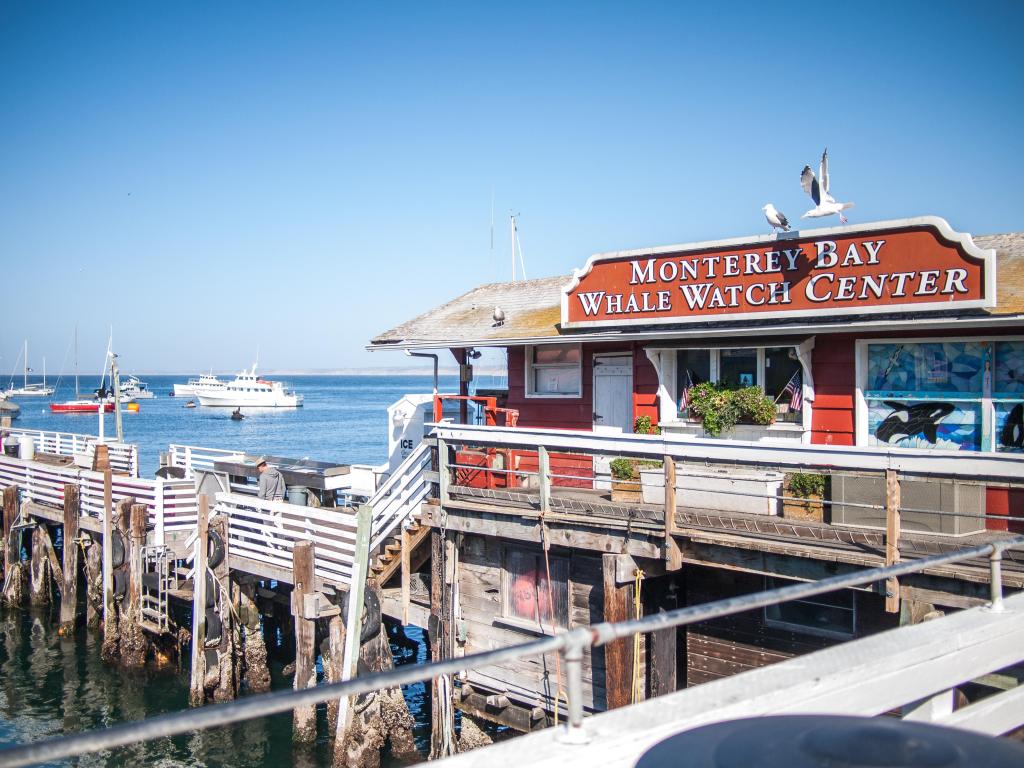 Monterey Bay Whale Watch Center wooden pier building on fisherman's wharf, California on a sunny day