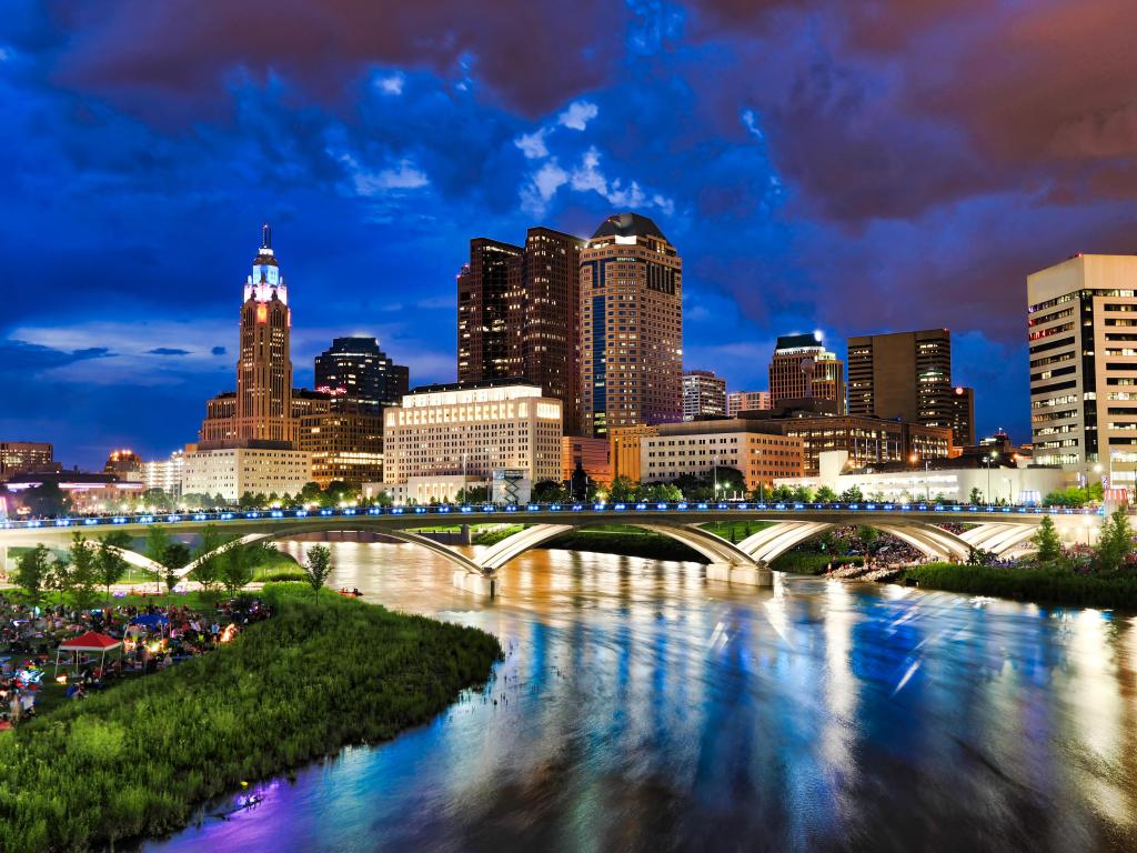 Columbus, Ohio, USA with crowds gathering along the banks of the Scioto River in anticipation of the annual red, white and boom fireworks display.