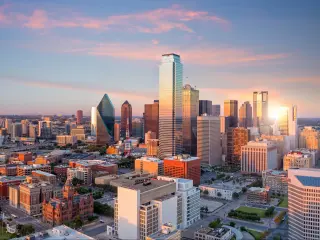 Dallas, Texas cityscape with blue sky at sunset, Texas