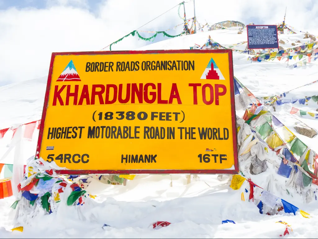 Khardung La pass has a slightly ambitious sign at the top that exaggerates its height to claim the highest road in the world status