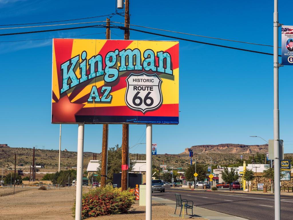 Welcome to Kingman street sign located on historic Route 66 on a sunny day