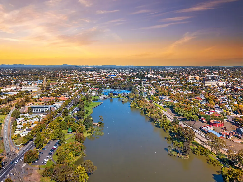 Aerial view of Lake Weeroona Bendigo. Sunrise sunset morning evening flight with spectacular views of red purple and blue skies and the Central Victoria Australia landscape.