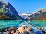Stunning mirror-like lake in Banff National Park, reflection of the mountains on the turquoise waters 