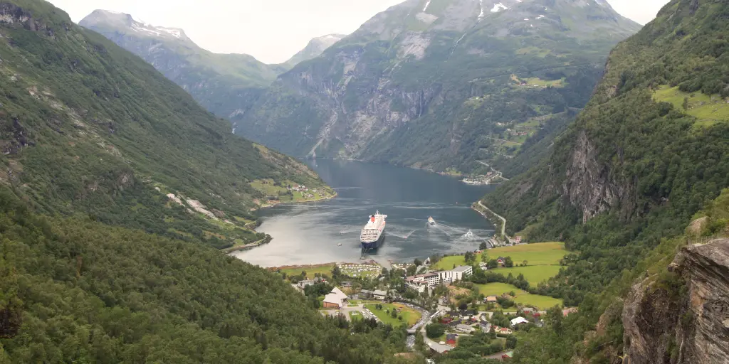 A cruise sails into the port in Geiranger, Norway
