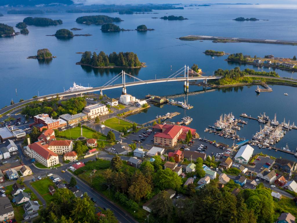 The picturesque town of Sitka on Baranof Island, Alaska with a bridge, marina and small islands in the background