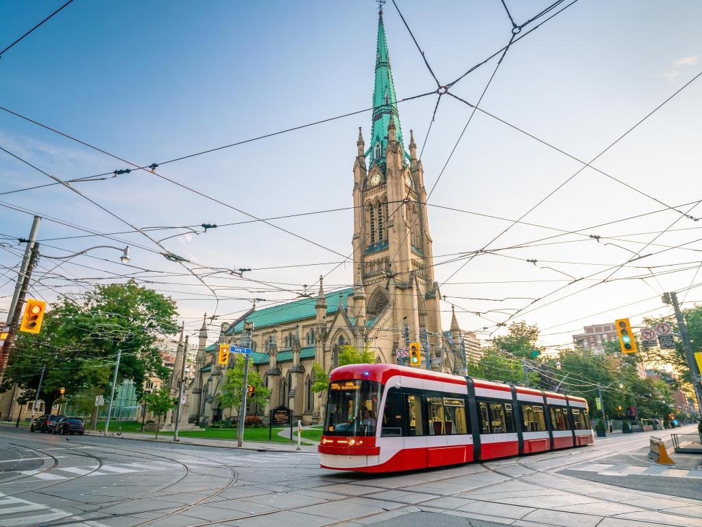 Downtown Toronto with a tram in focus, a church in the background
