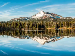The Sisters and Broken Back Mountains in the Cascade Mountains near Bend, Oregon.