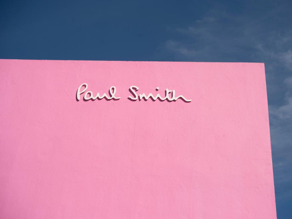The entirely pink wall of the Paul Smith Store in LA on a sunny day