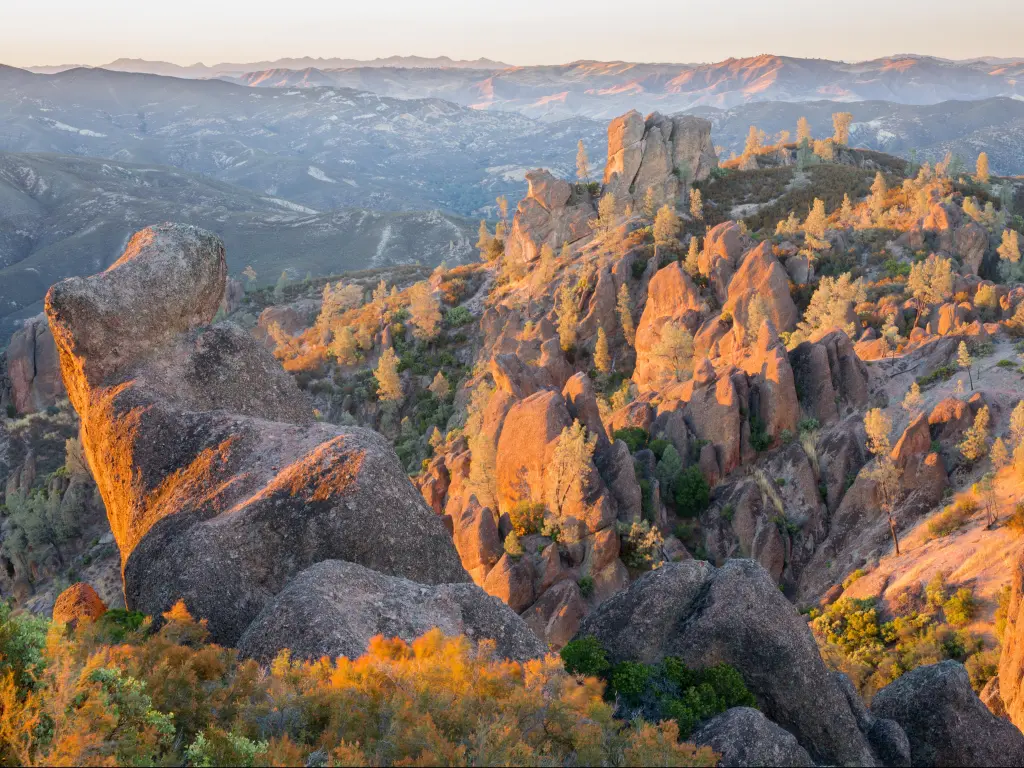 Pinnacles National Park, California taken at height from the High Peaks just before sunset with mountains faint in the distance. 