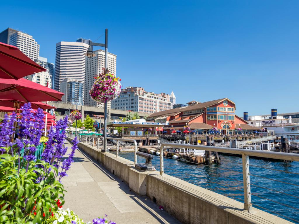 Flowers bloom on Pier 55 in Seattle, Washington, on a sunny day