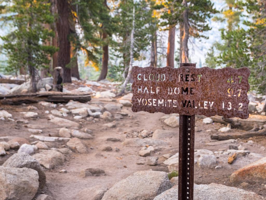 Posted hiking trail sign with the distances in miles to Cloud's Rest, Half Dome and Yosemite Valley