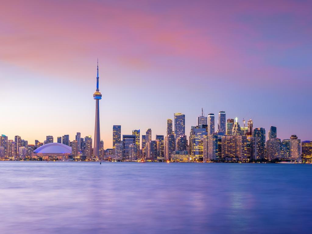 Toronto skyline from across the water at sunset.