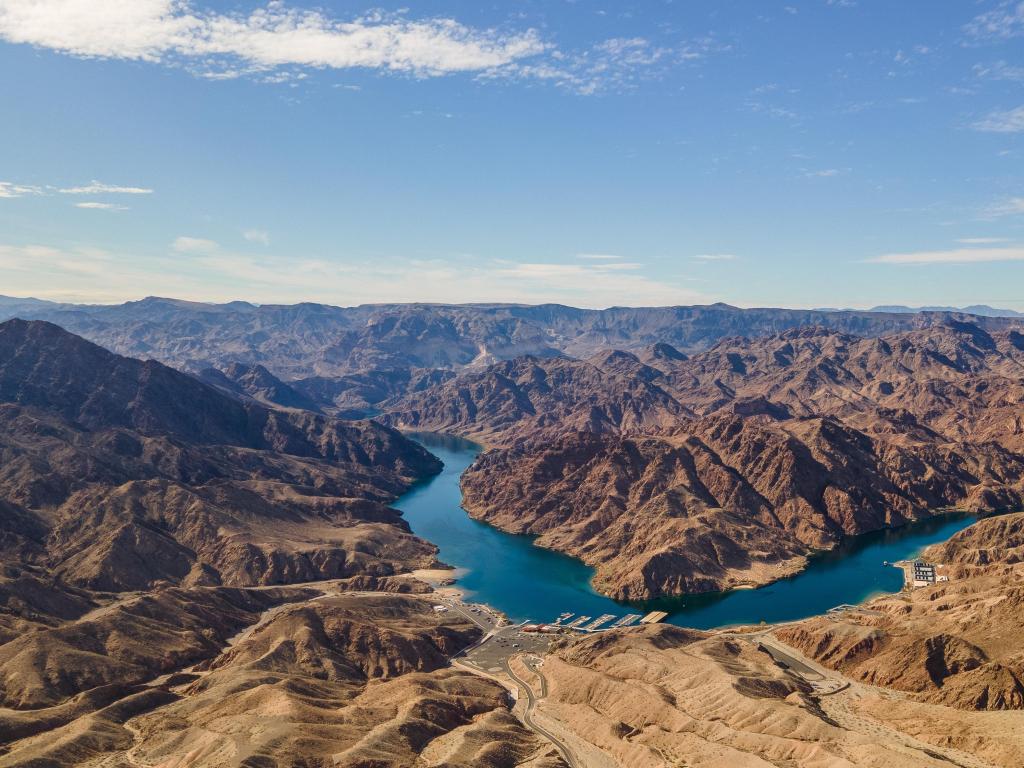 Aerial drone panoramic show of Willow Beach, Arizona, showing the rugged mountains surrounding the azure waters of the Colorado River