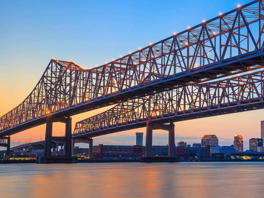 The Crescent City Connection Bridge on the Mississippi river and downtown New Orleans Louisiana