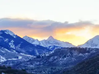 Mountains in the Aspen and Snowmass area of Colorado, with a dusky sky above