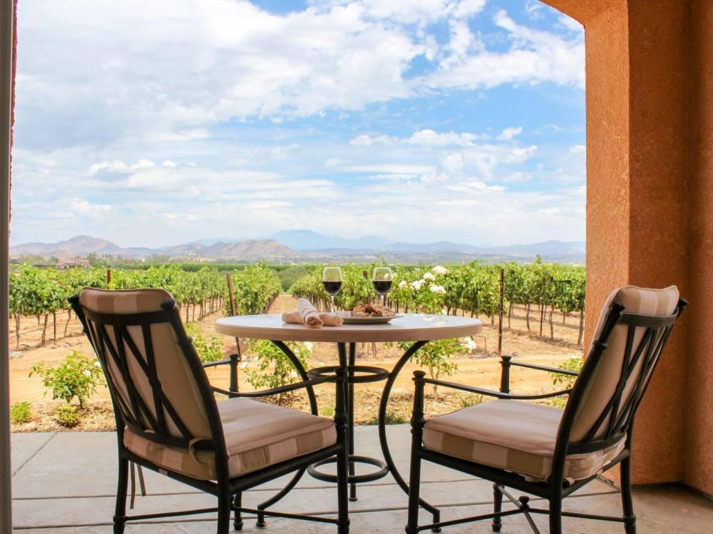 View across Carter Estate Winery & Resort, with chairs and table with wine and treats in the forefront