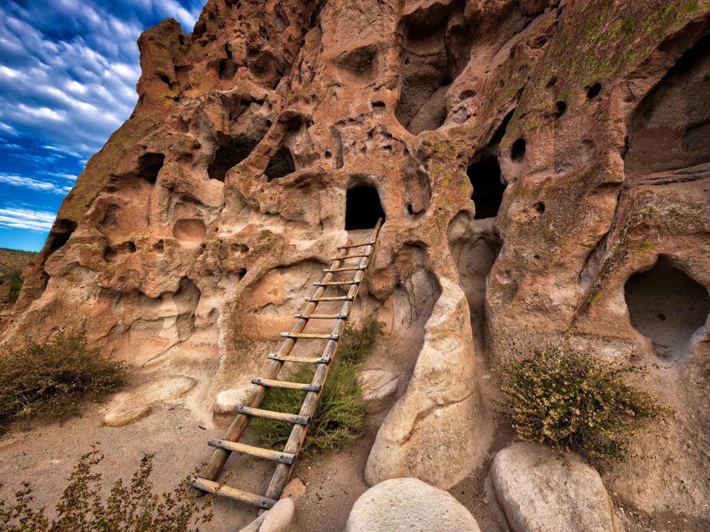 Doorways and windows made in the sandy rock face in a historic cliff dwelling