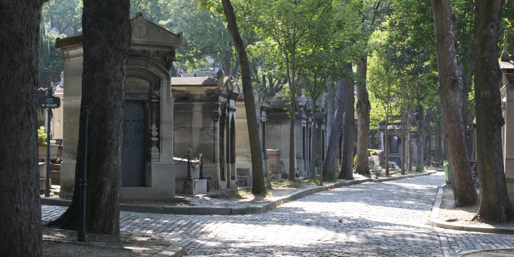 Shaded walking paths in Père Lachaise cemetery in Paris