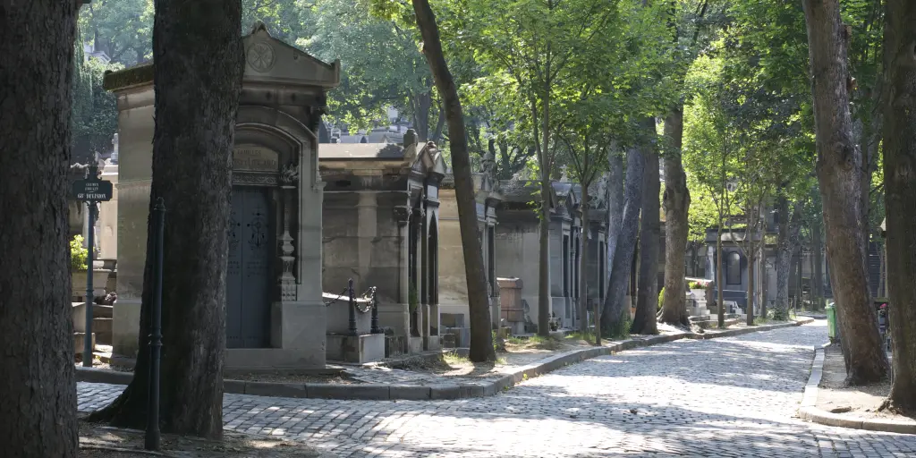 Shaded walking paths in Père Lachaise cemetery in Paris