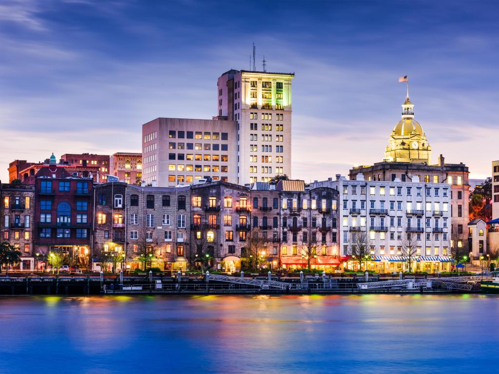 Savannah, Georgia, USA downtown riverfront skyline at night. 