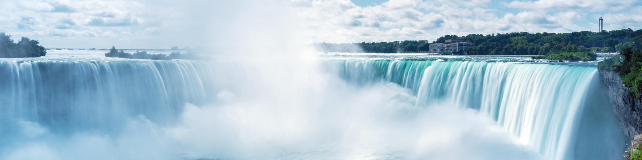 Niagara Falls, Ontario, Canada with a view of Horseshoe Fall on a sunny day.